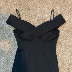 Black fitted dress with leg slit